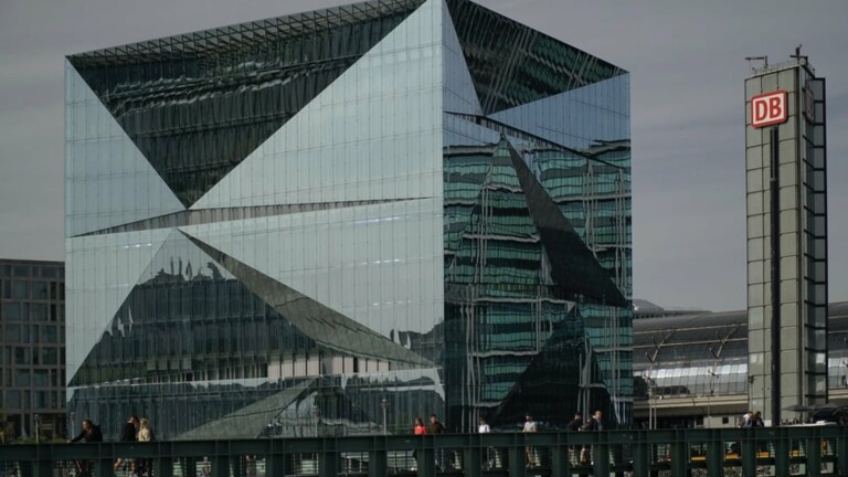 glass building under gray sky during daytime